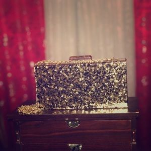 Glitter clutch with chained strap